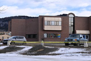 Crime scene tape surrounds a high school at the site of a deadly mass shooting in the town of Tumbler Ridge
